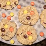 Monster Cookies with Reese's Pieces on a black tray.