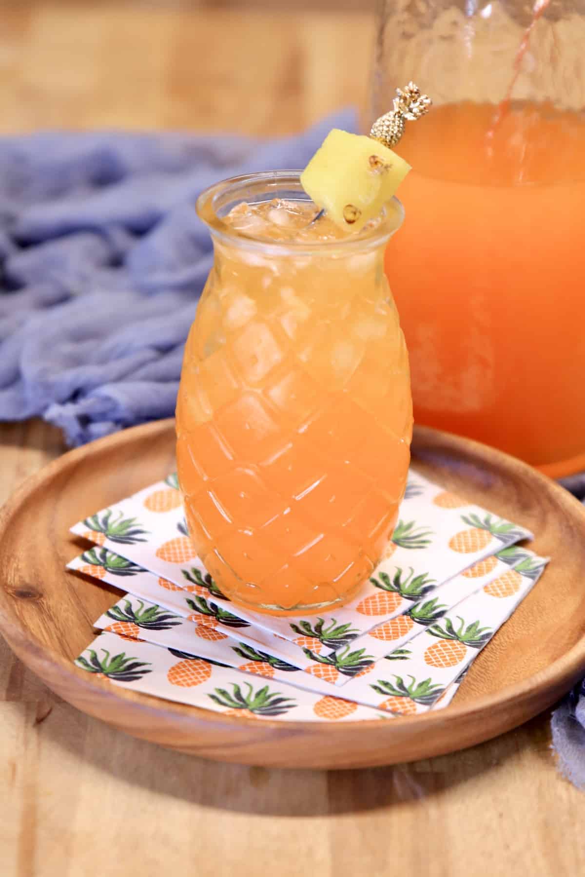 Pineapple glass with orange and pineapple wine punch.