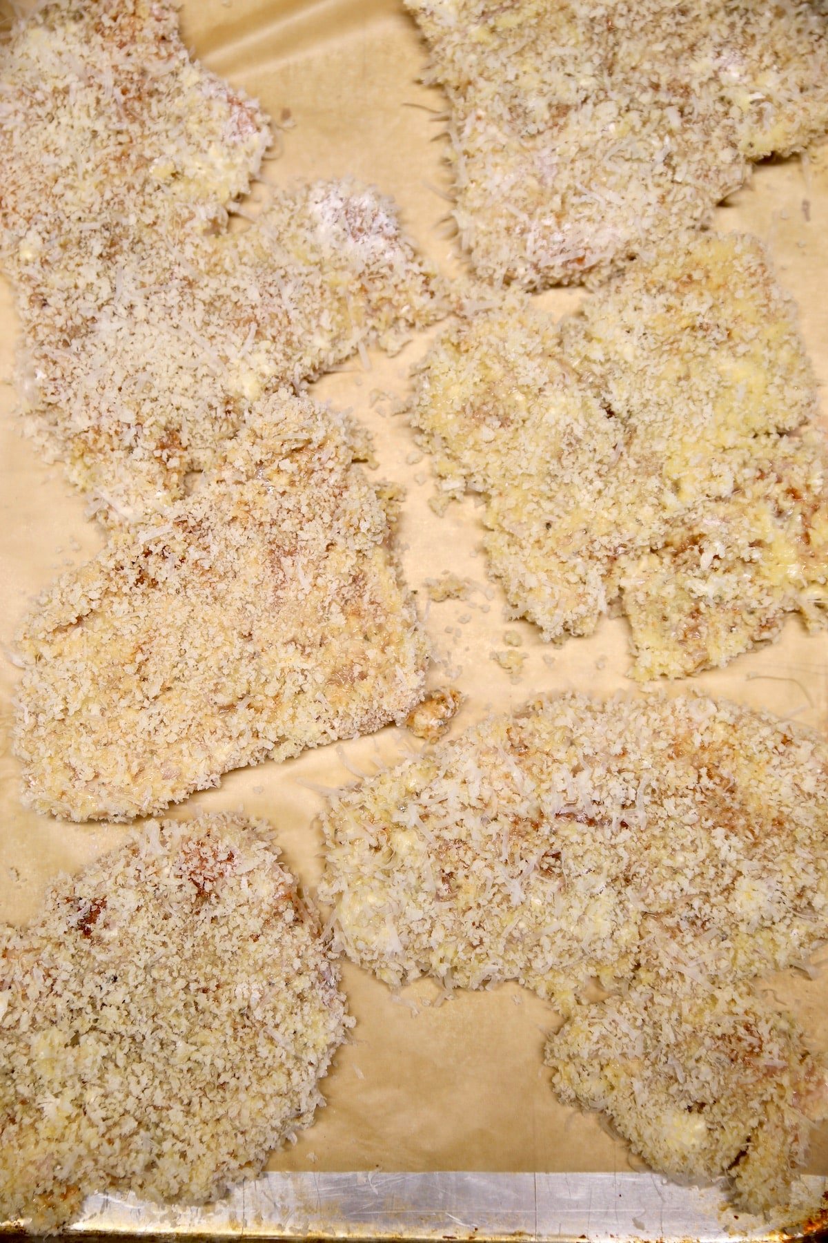 Breaded chicken cutlets ready to fry.