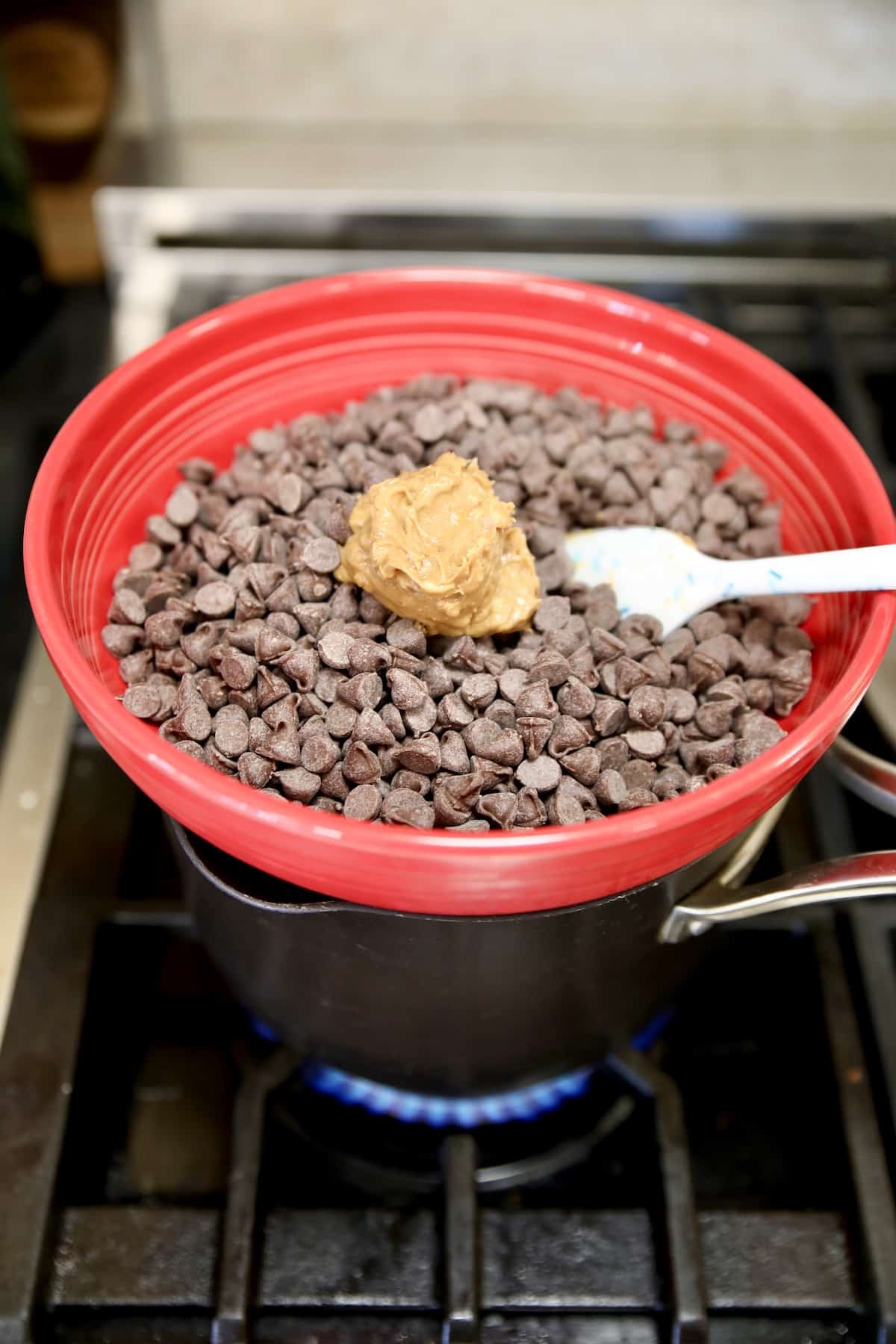 Using a bowl and pan as double boiler to melt chocolate.