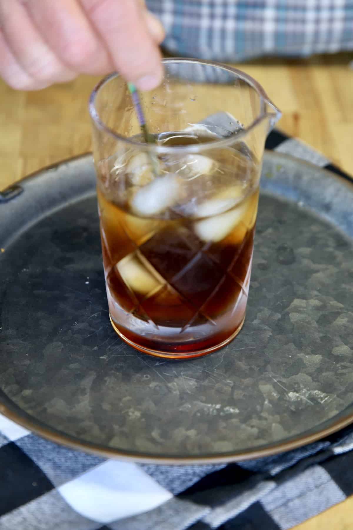 Stirring Black Russian Cocktail.