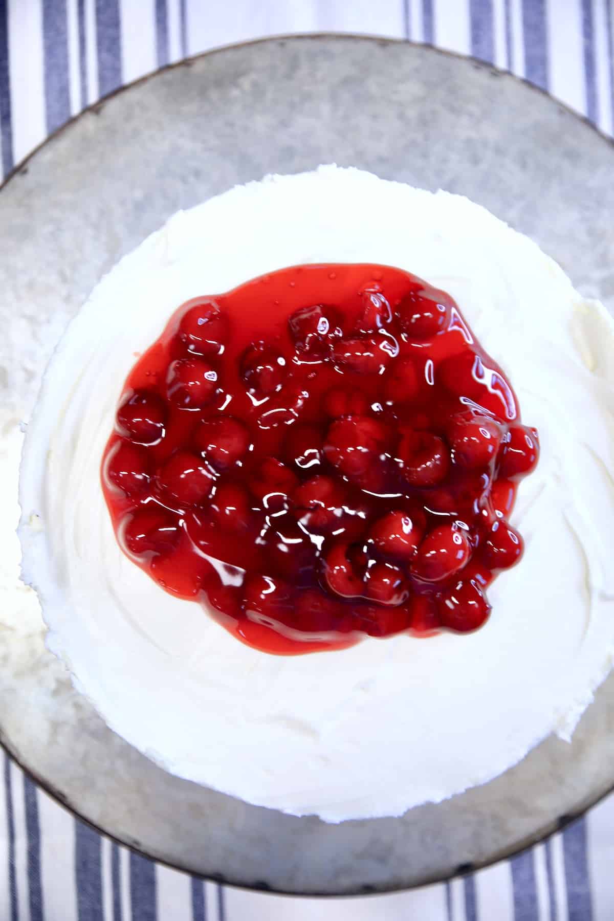 Cherry pie filling over vanilla cheesecake.