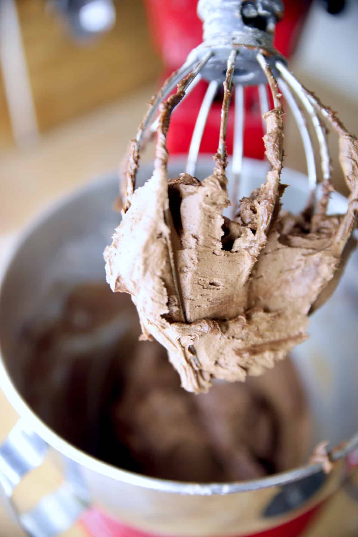Chocolate buttercream on mixer whisk.