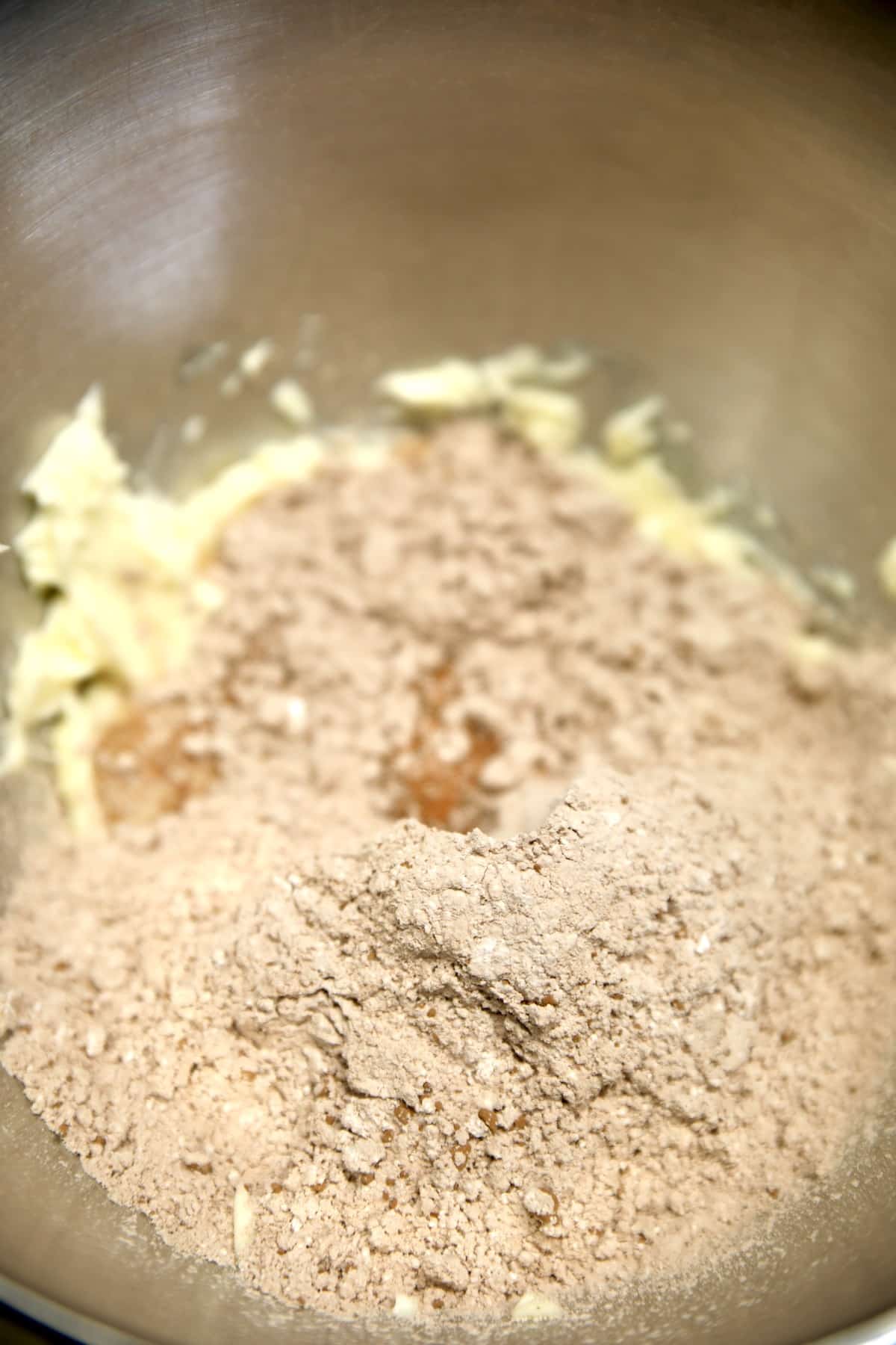 Bowl with butter, cocoa powder and powdered sugar.
