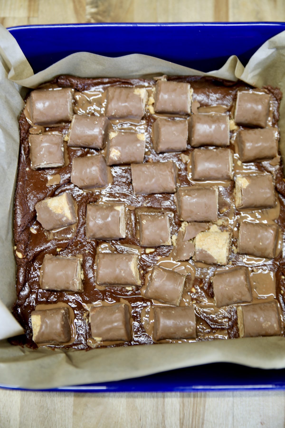 Candy bar fudge in a square pan.