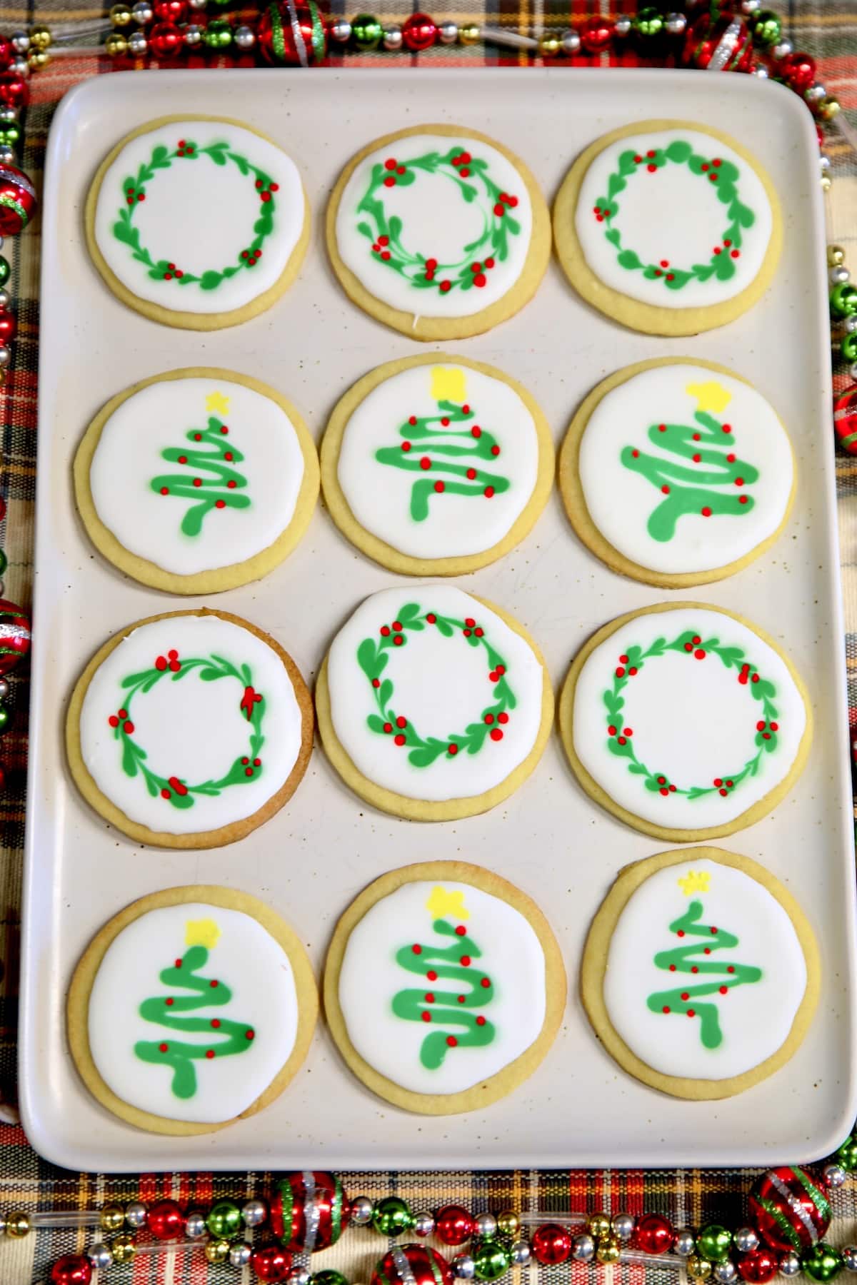 Platter of decorated iced sugar cookies.