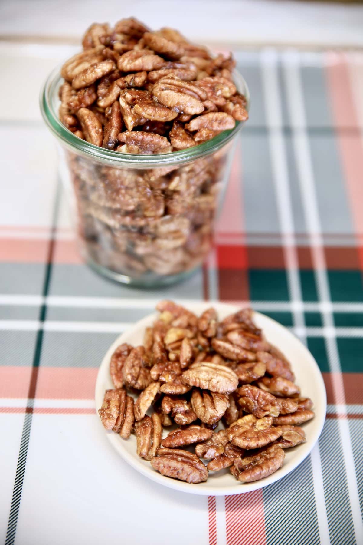 Jar and bowl of candied pecans.