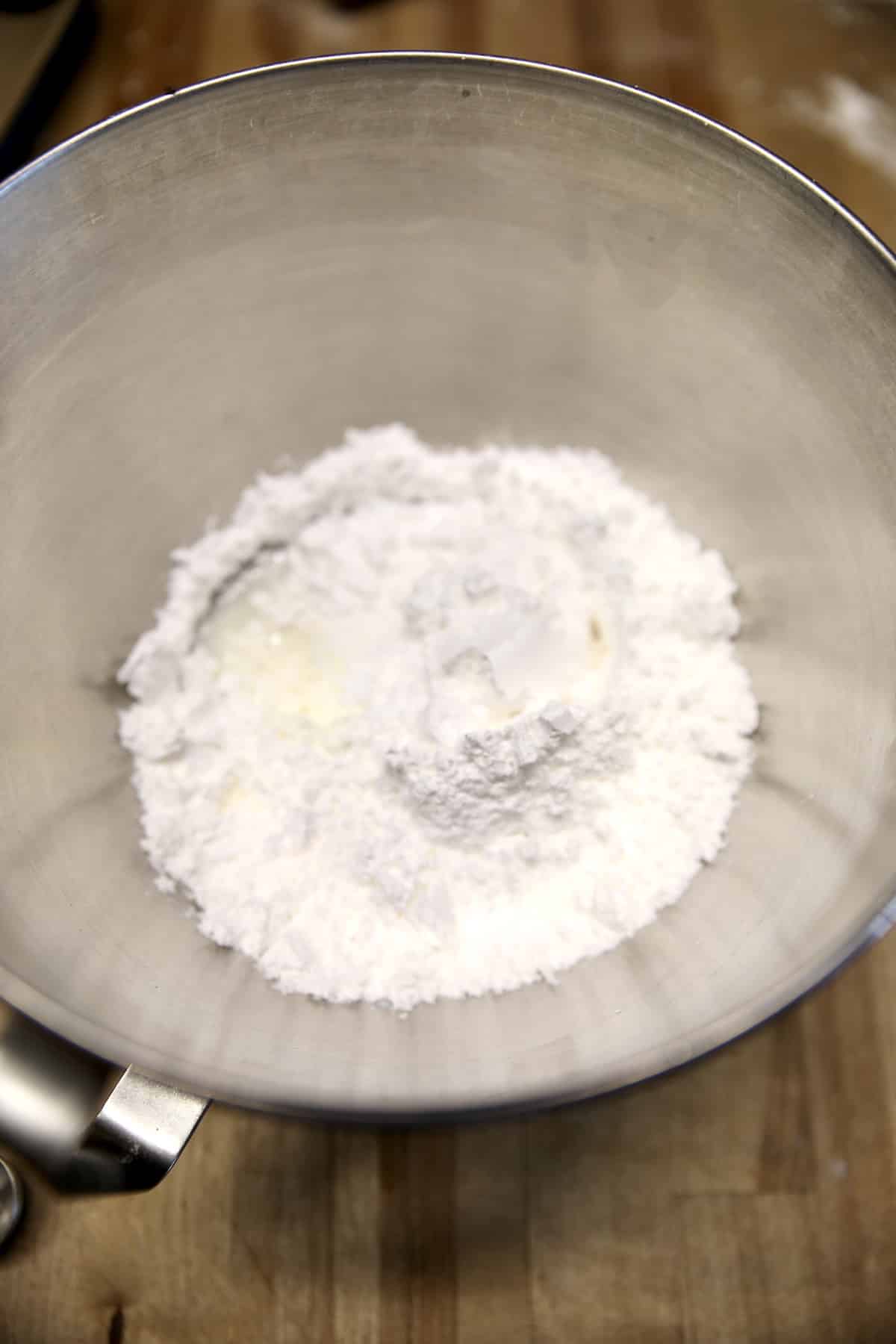 Powdered sugar icing ingredients in a bowl.