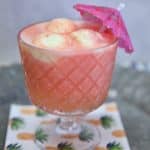 Sherbet Punch in a cocktail glass with an umbrella.