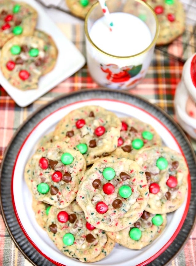 Platter of Christmas cookies, milk, plate of cookies.