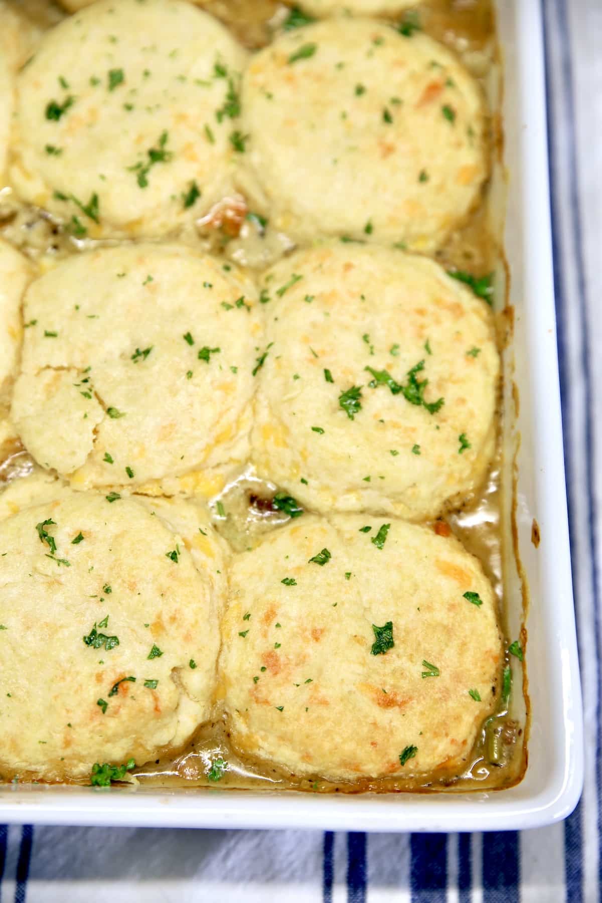 Casserole dish with chicken and biscuits.