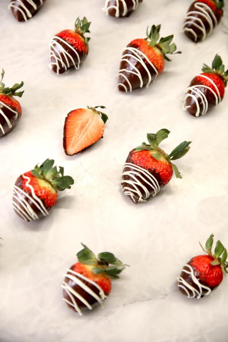 Chocolate dipped strawberries with white drizzle.