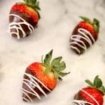 Chocolate Covered strawberries with white chocolate drizzle.