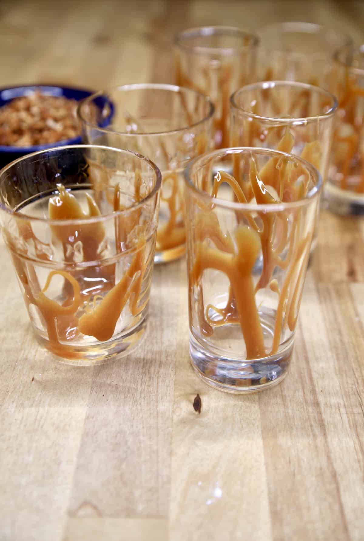 Dessert glasses drizzled with caramel sauce.