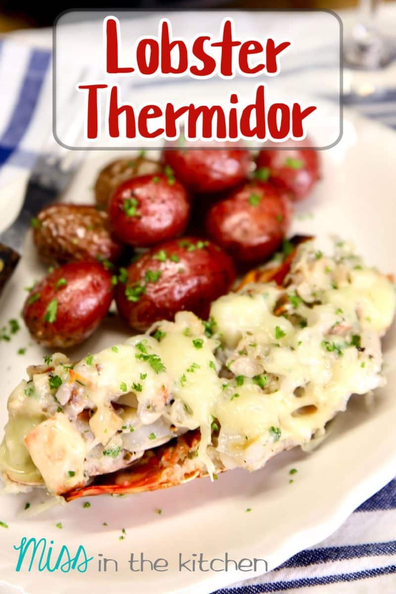 Lobster Thermidor on a plate with baby red potatoes. Text overlay.
