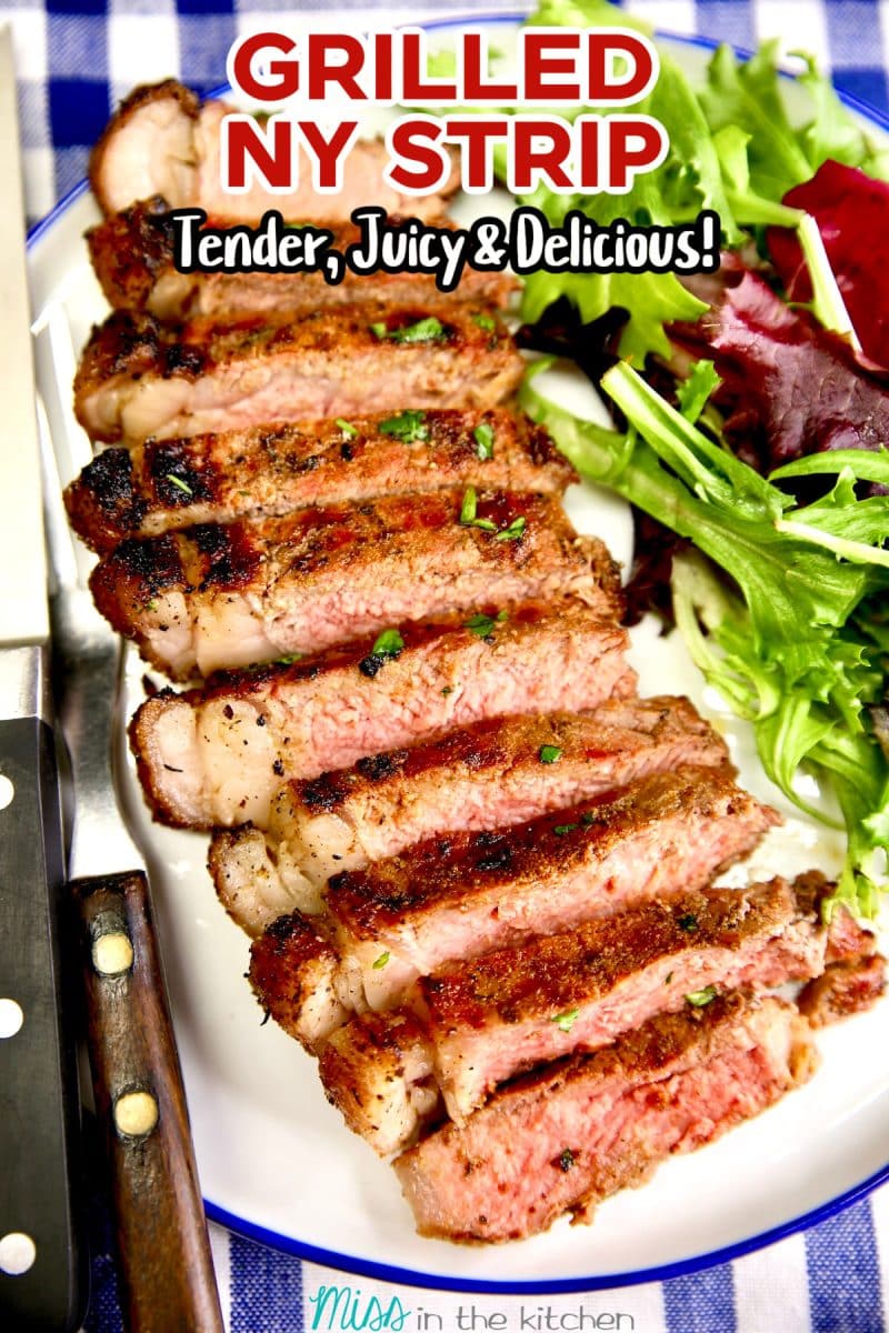 Sliced steak on a plate with salad greens. Text overlay.