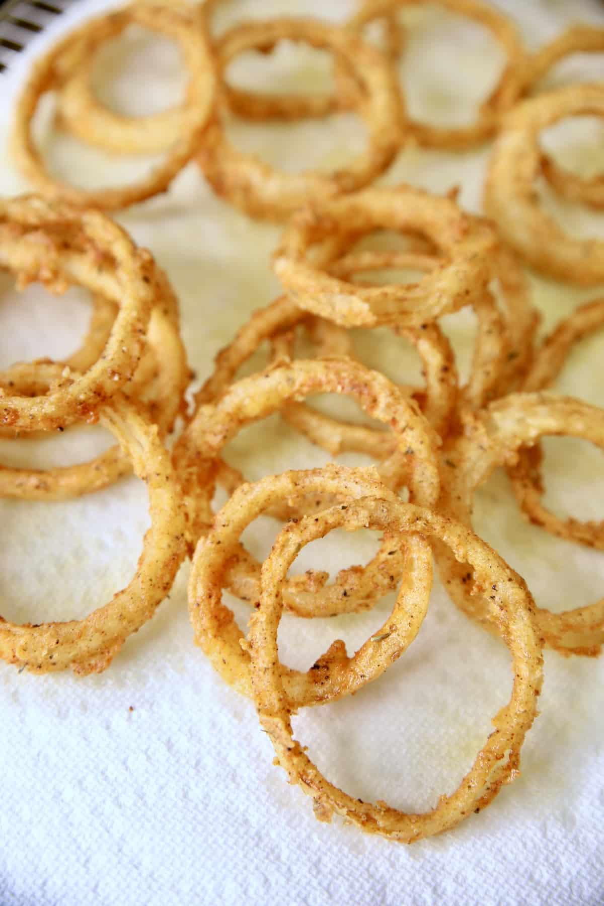 Onion rings on a paper towel.