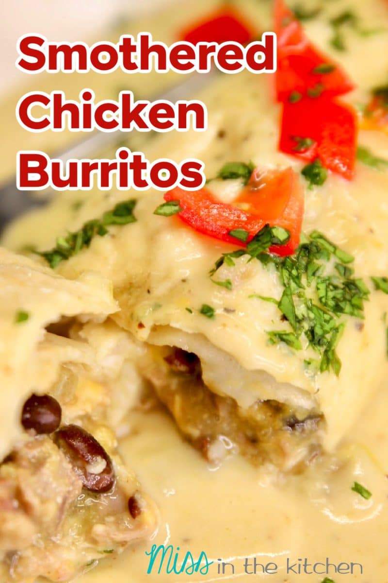 Smothered Chicken Burritos with black beans, cut in half. Text overlay.