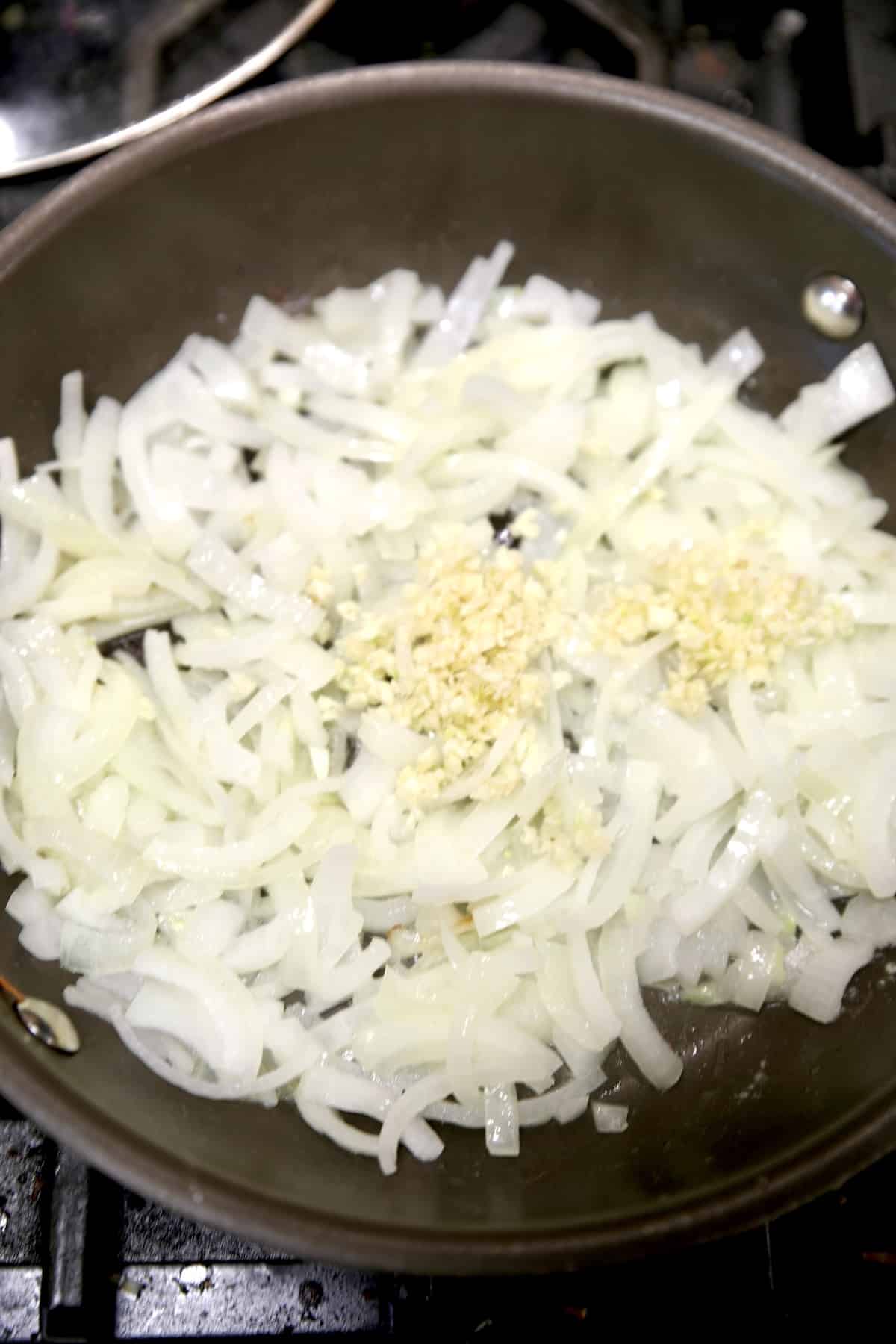 Skillet with onions and garlic. 