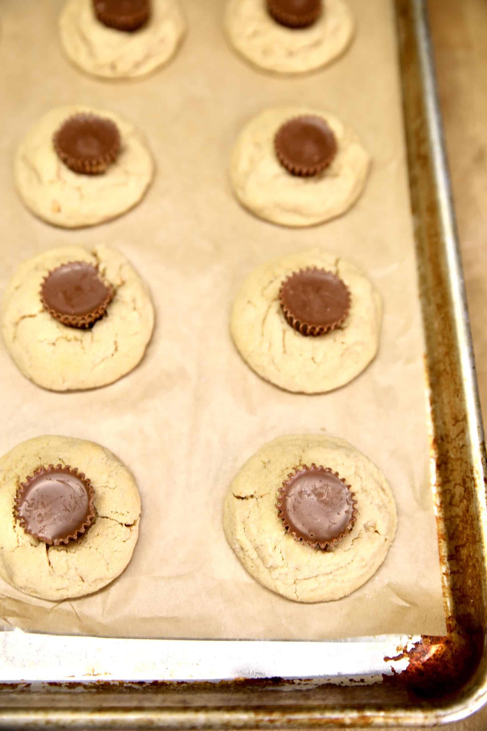 Peanut butter cookies with mini peanut butter cup in center.