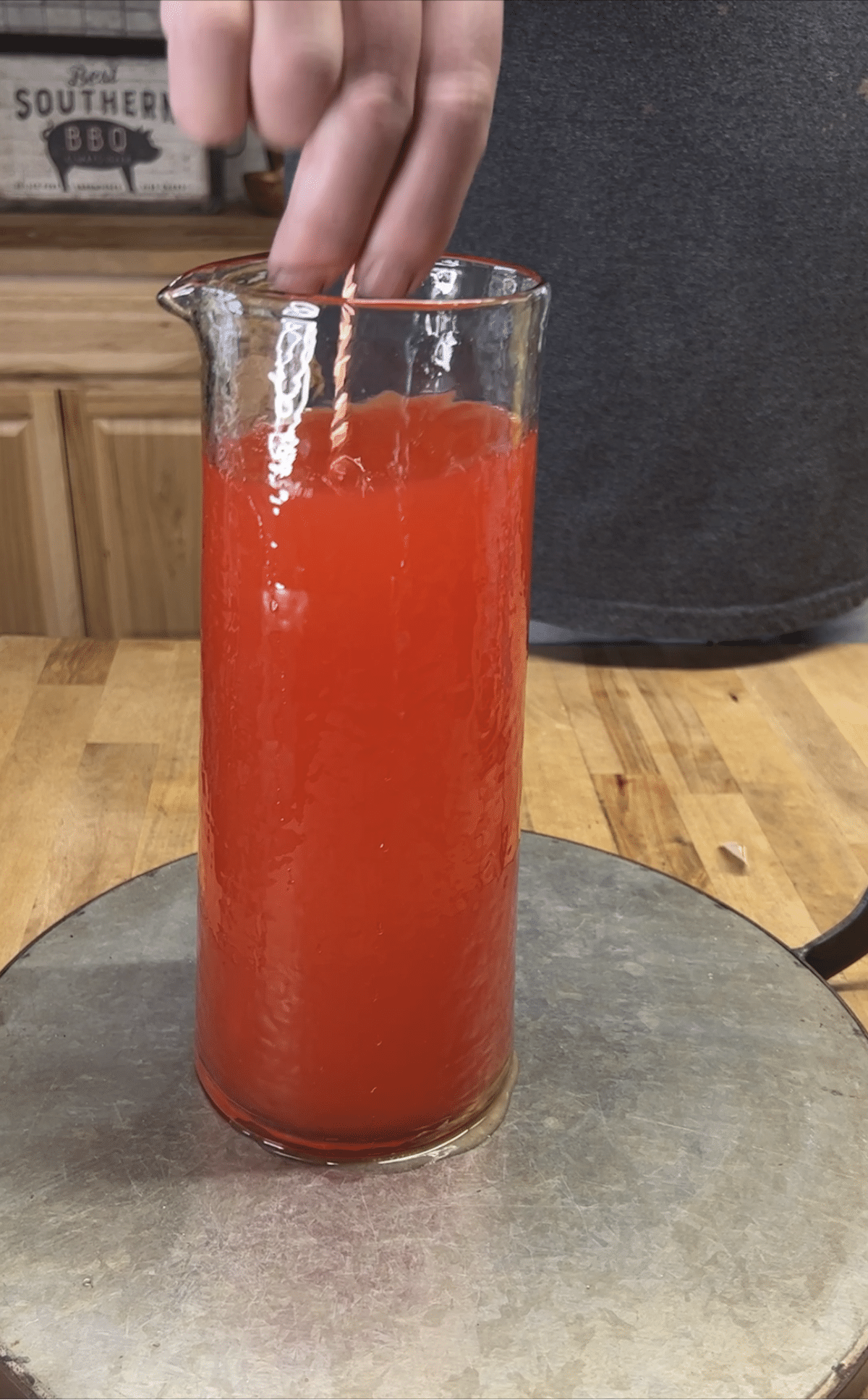 Stirring punch in a pitcher.