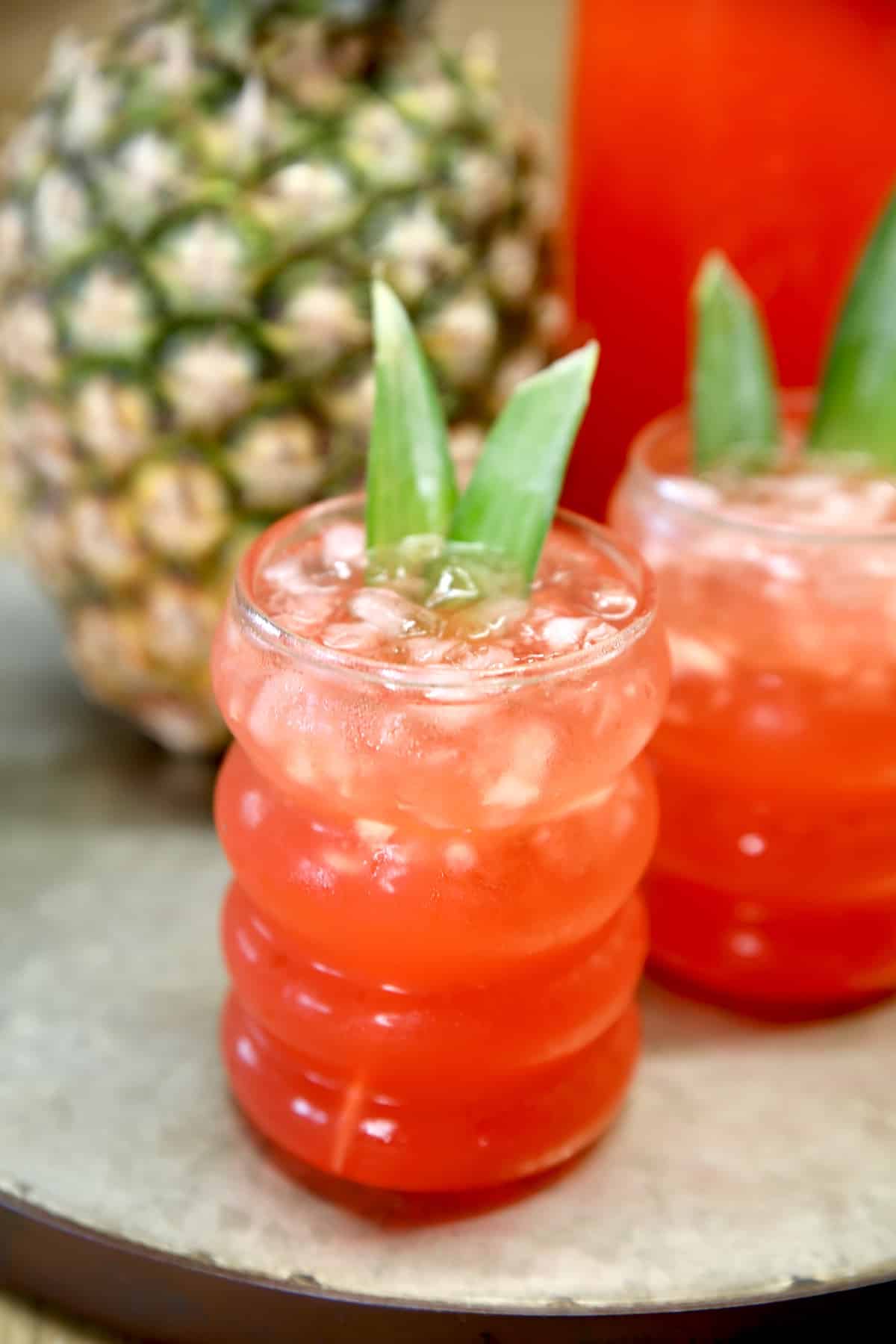2 glasses of red rum punch, fresh pineapple.