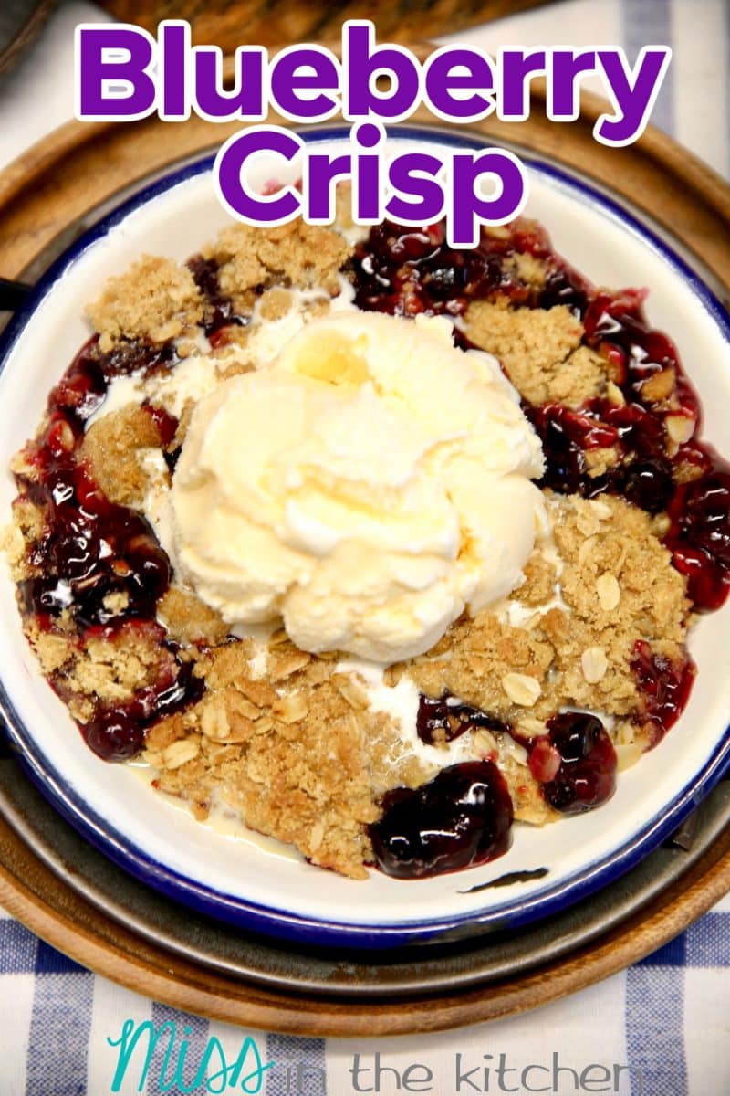 Blueberry Crisp with vanilla ice cream - text overlay.