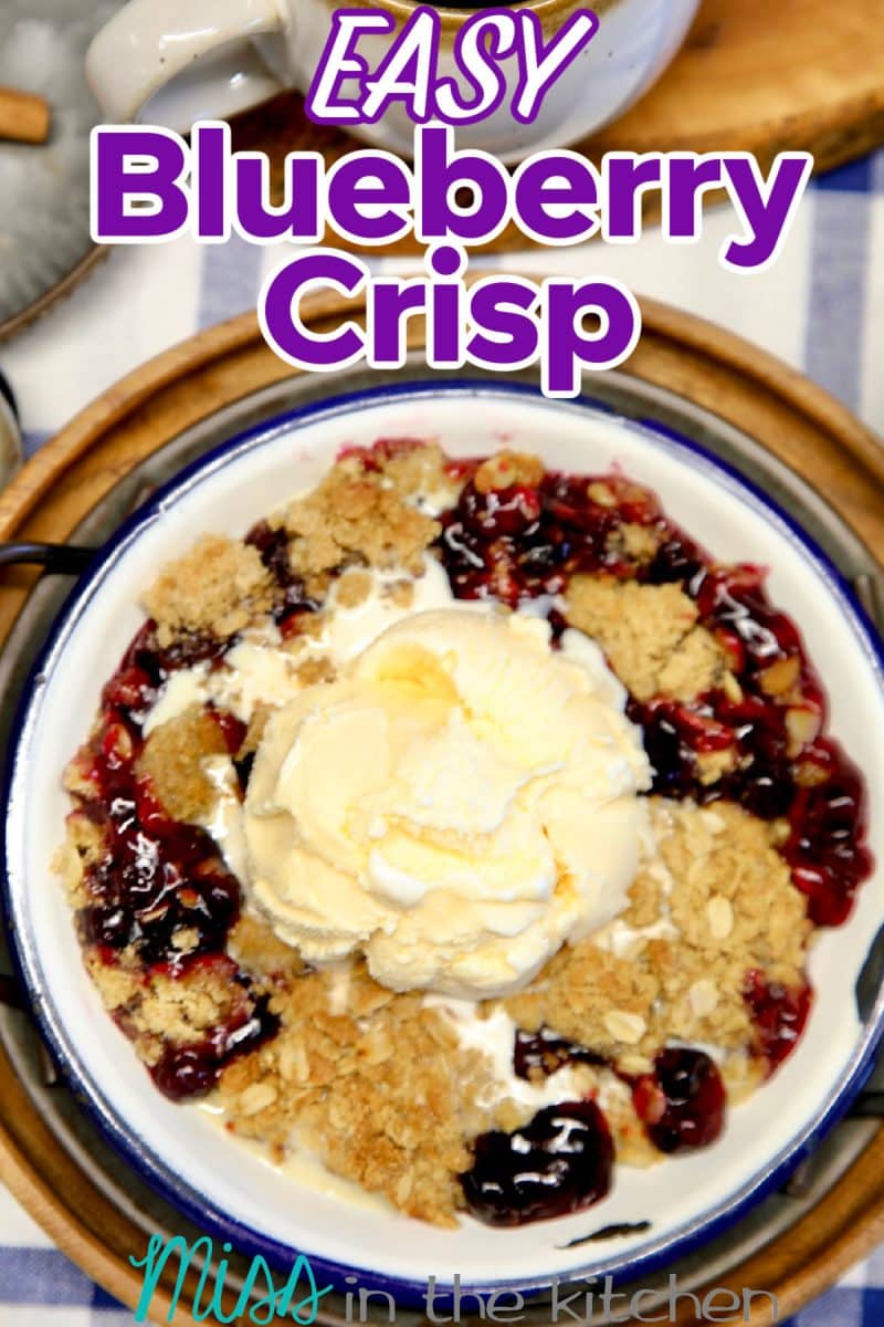 Blueberry crisp with vanilla ice cream in a bowl. Text overlay.