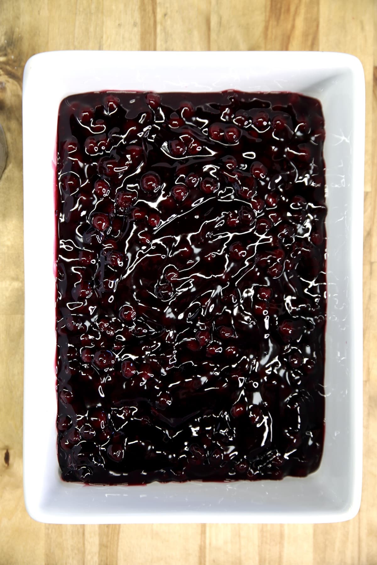 Rectangle baking dish with blueberry pie filling.