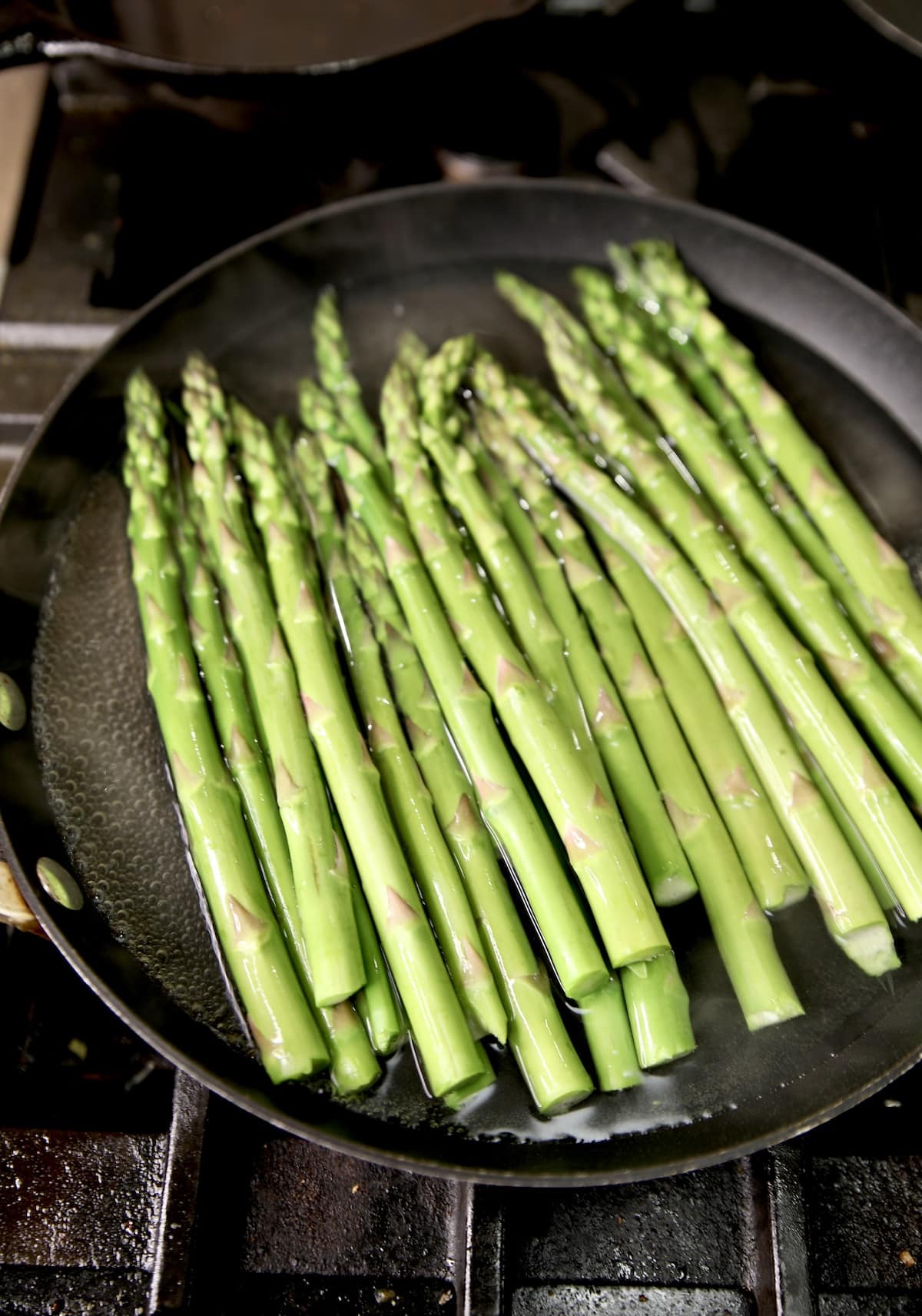 Cooking asparagus in boiling water. 