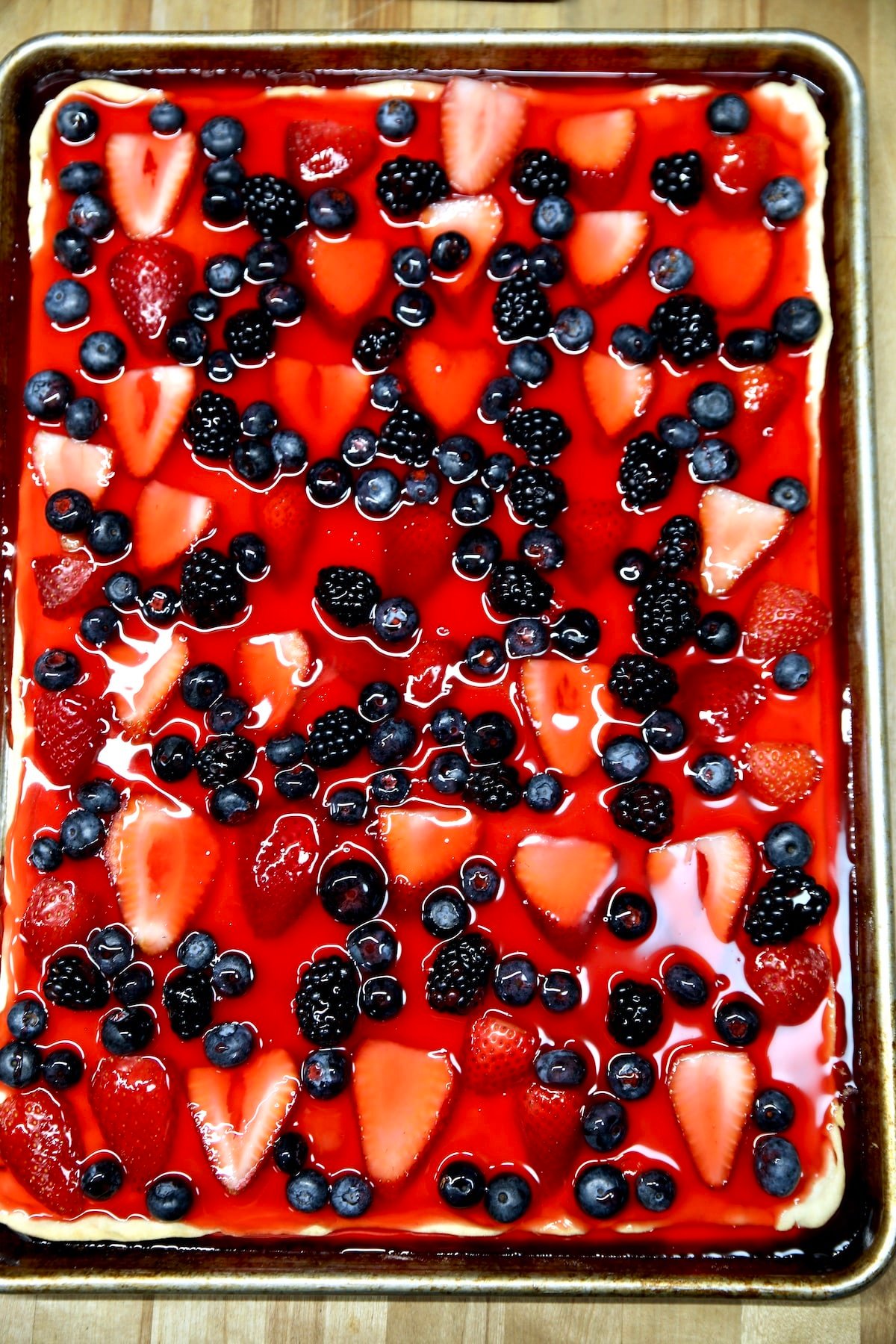 Strawberry, blueberry, blackberry Jello pie in a sheet pan.