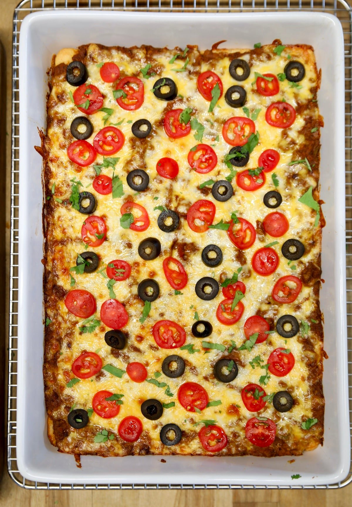 Burrito casserole bake with tomatoes and olives.