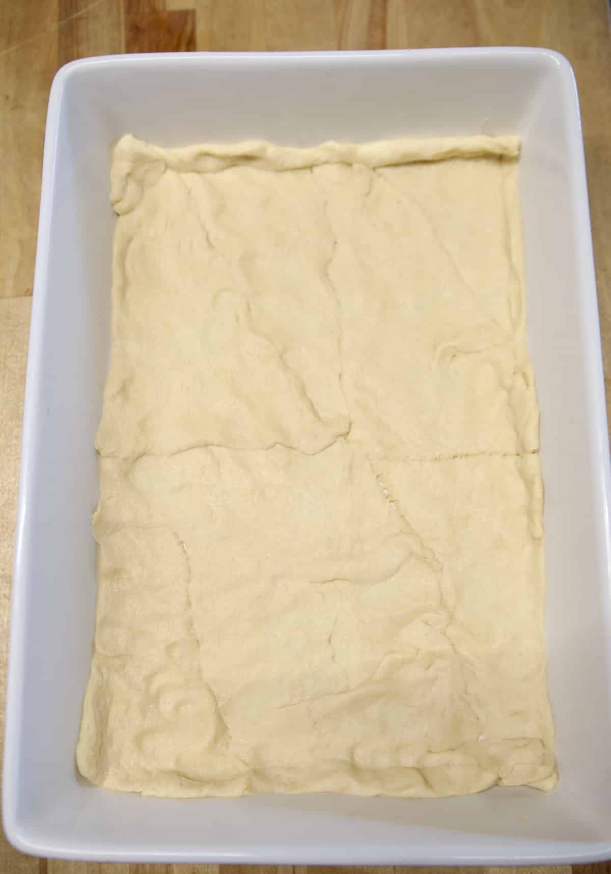 Crescent Dough crust in a pan for burrito bake.