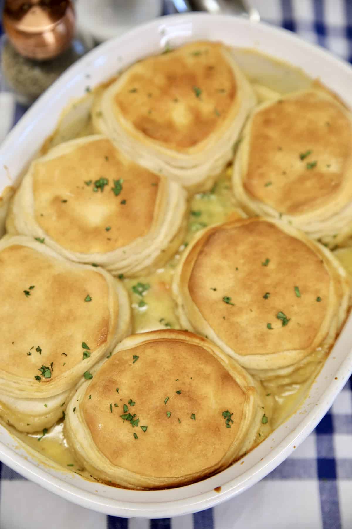 Chicken pot pie casserole with biscuit topping.