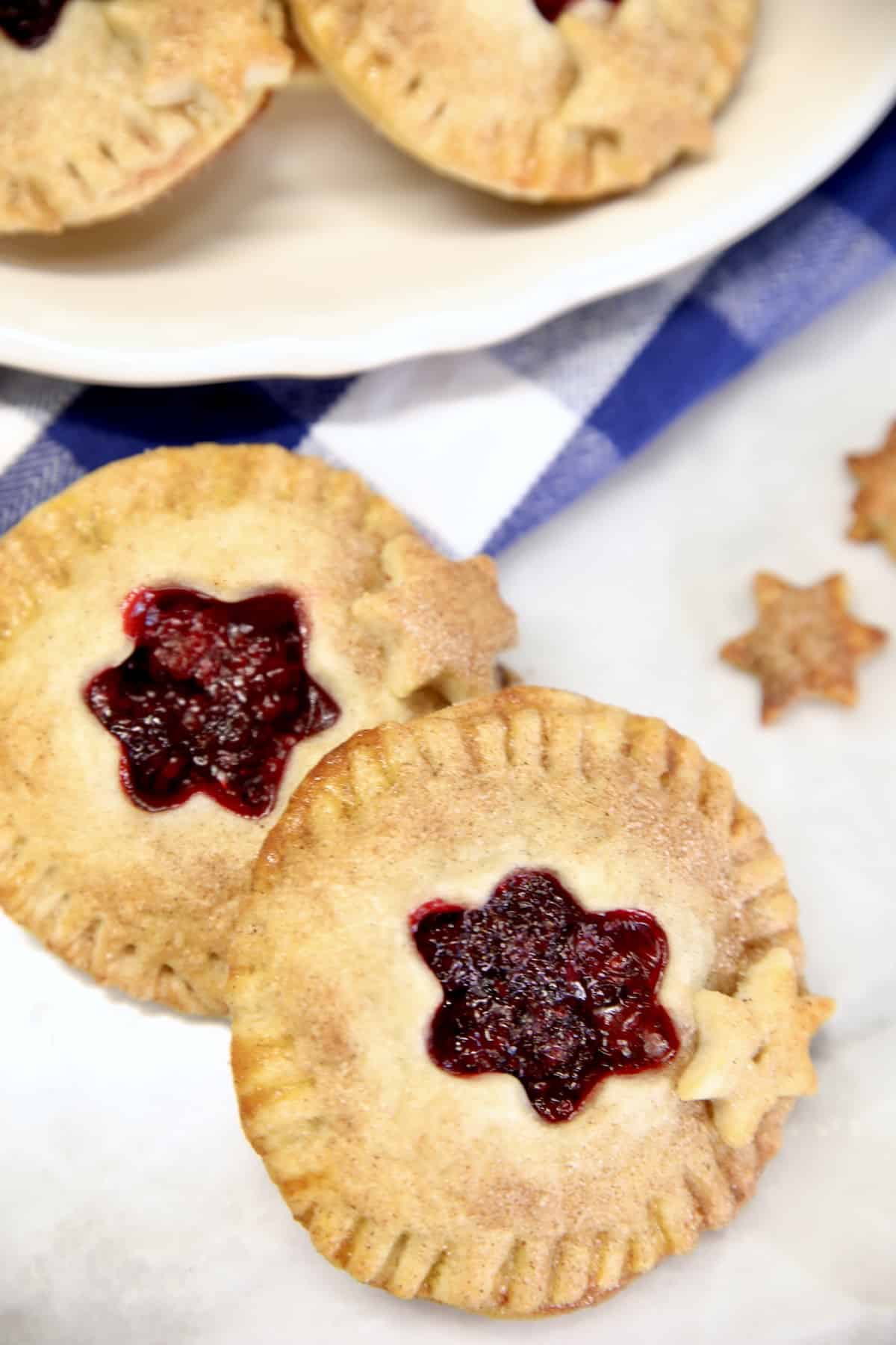 2 Blackberry Hand Pies with star cut outs. 
