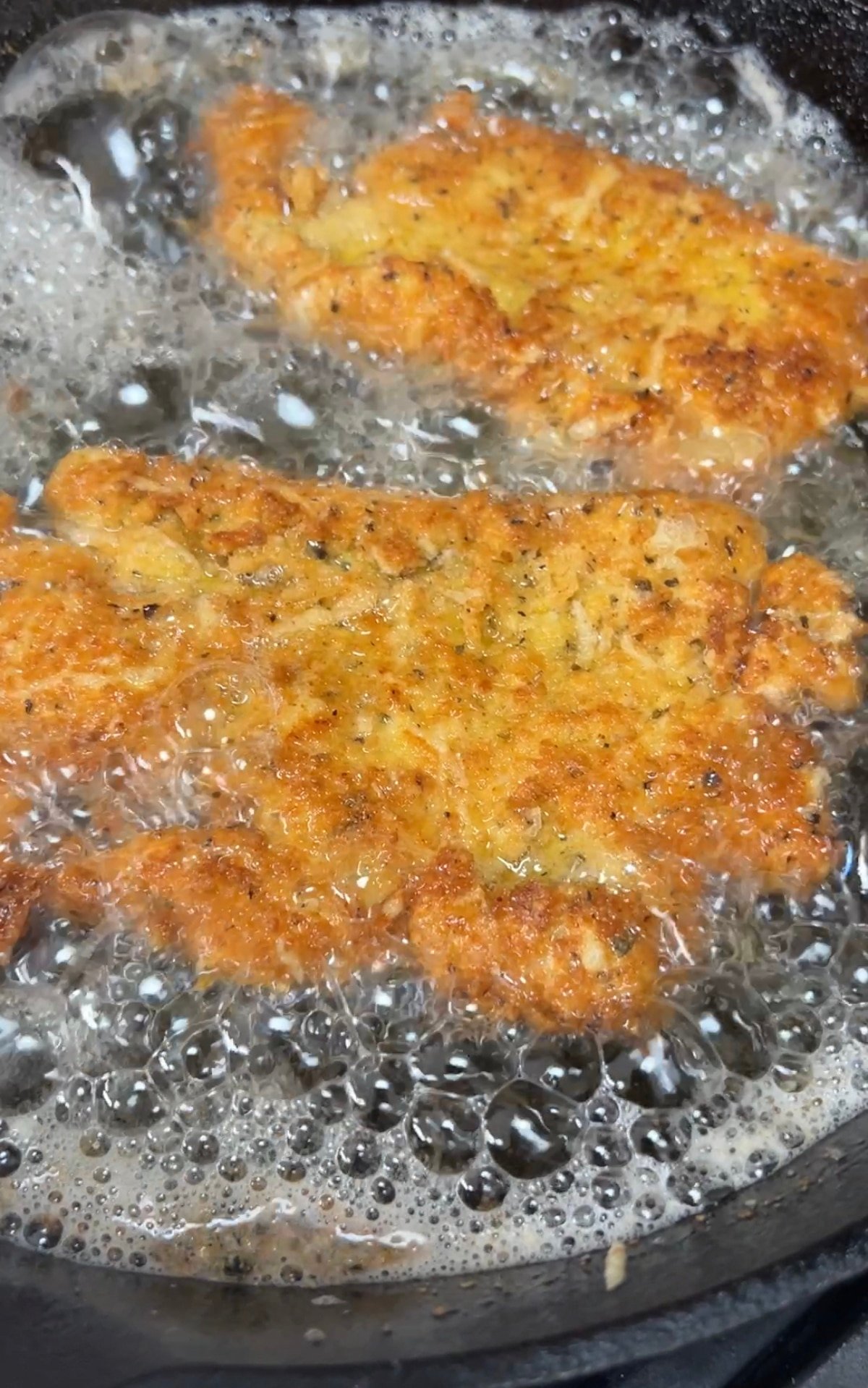 Frying chicken cutlets in a skillet.