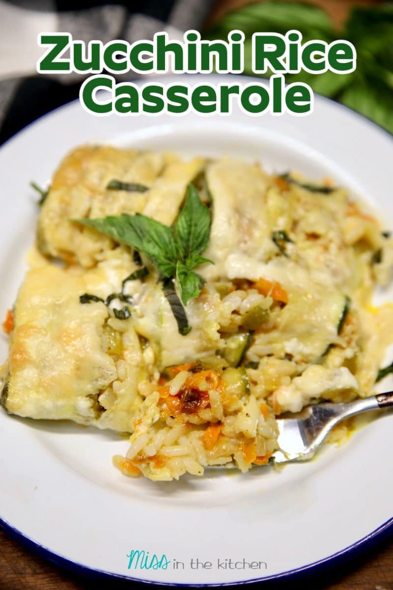 Zucchini Rice Casserole on a plate with a fork, text overlay.