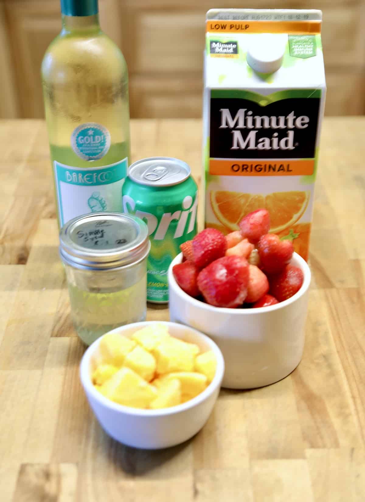 Ingredients for strawberry mango wine coolers.
