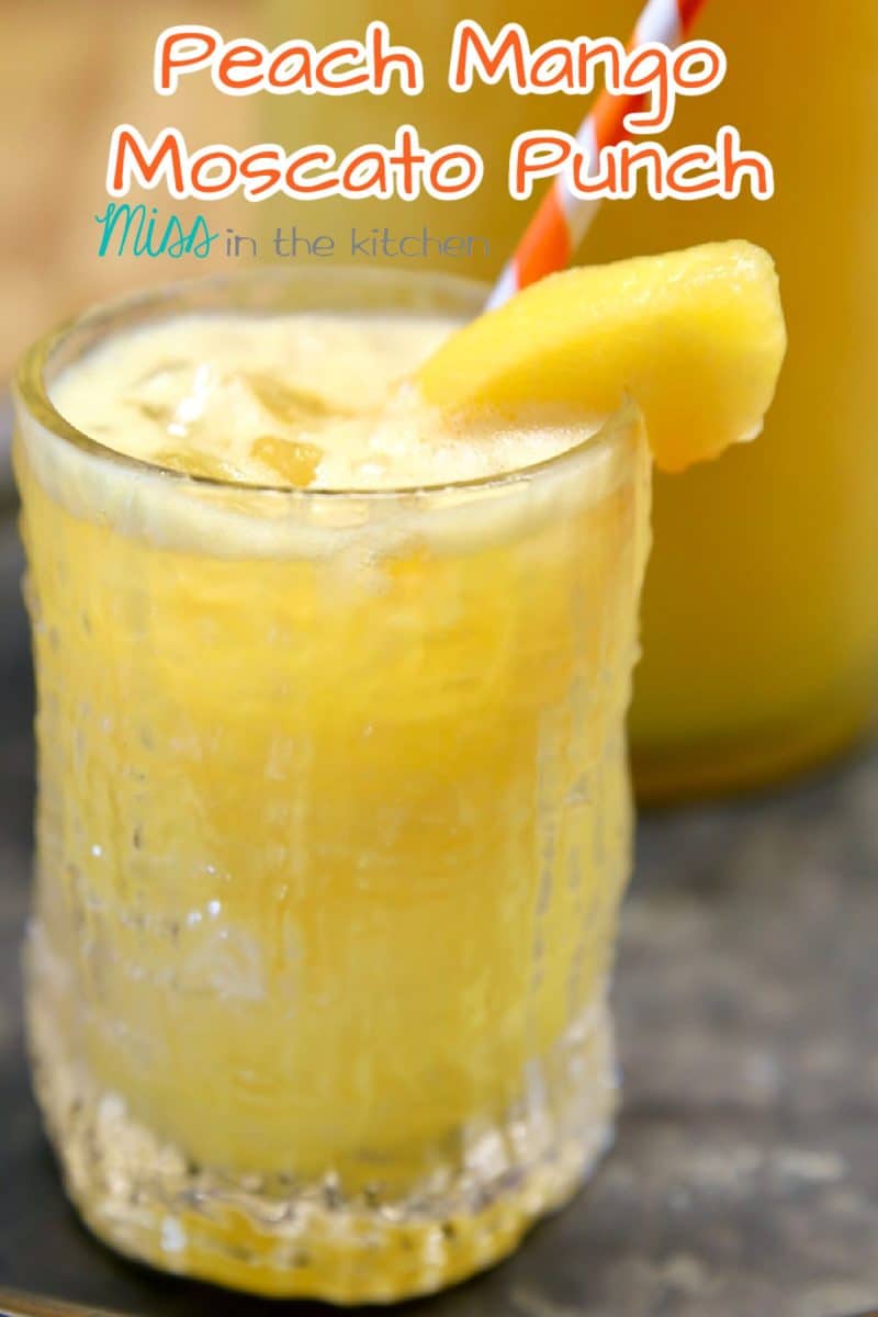 Peach Mango Moscato Punch in a glass - text overlay.