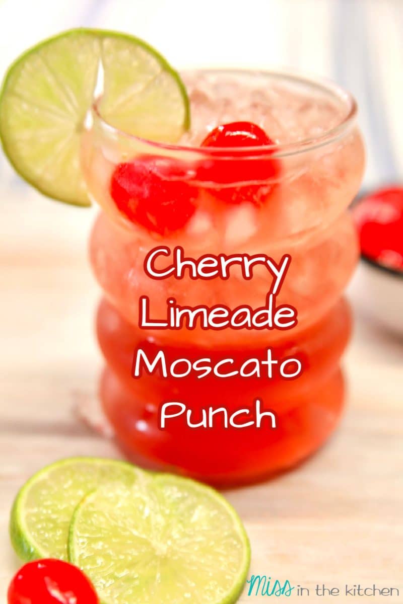 Cherry Limeade Moscato Punch in a glass- text overlay.