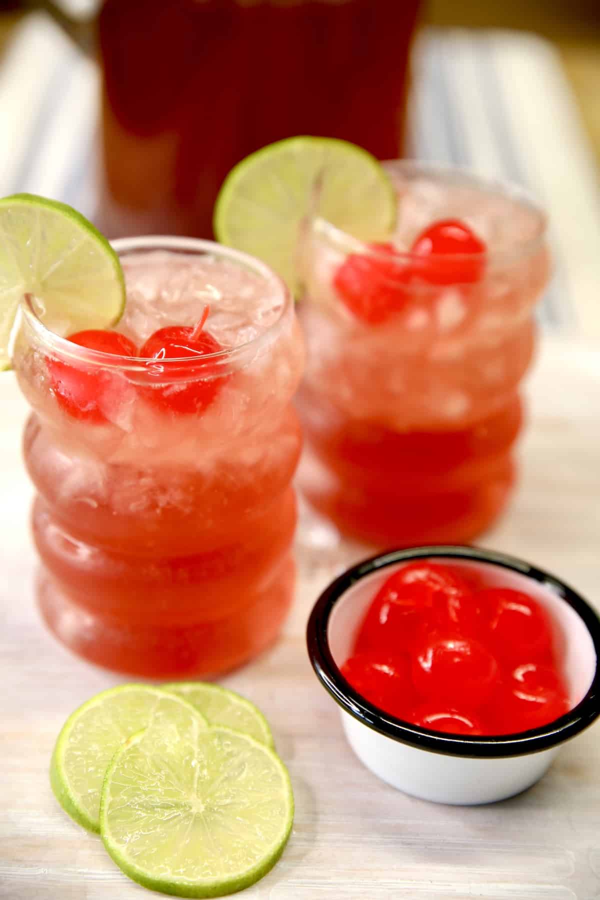 2 glasses of cherry limeade cocktail.