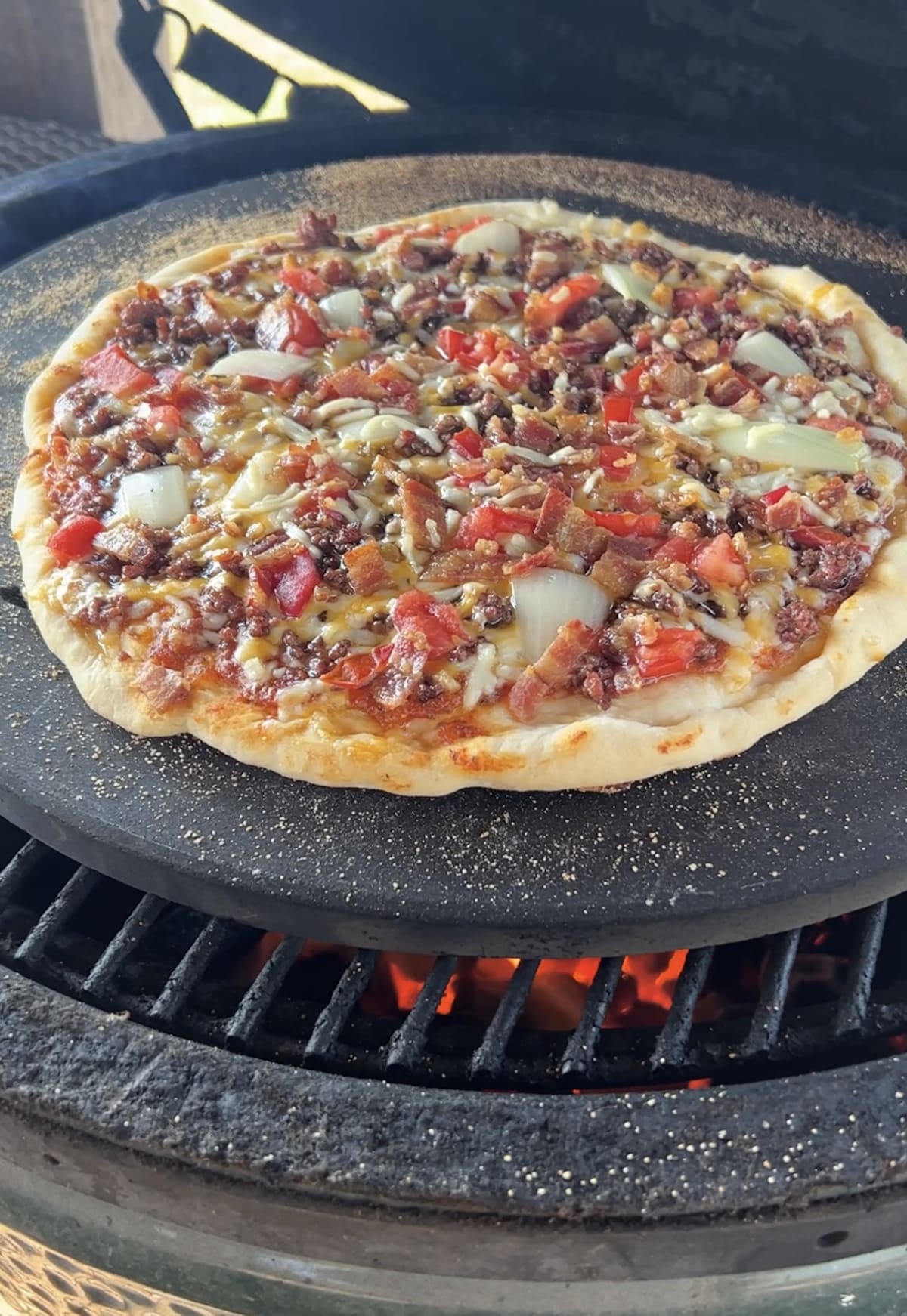 Grilling pizza on a pizza stone.