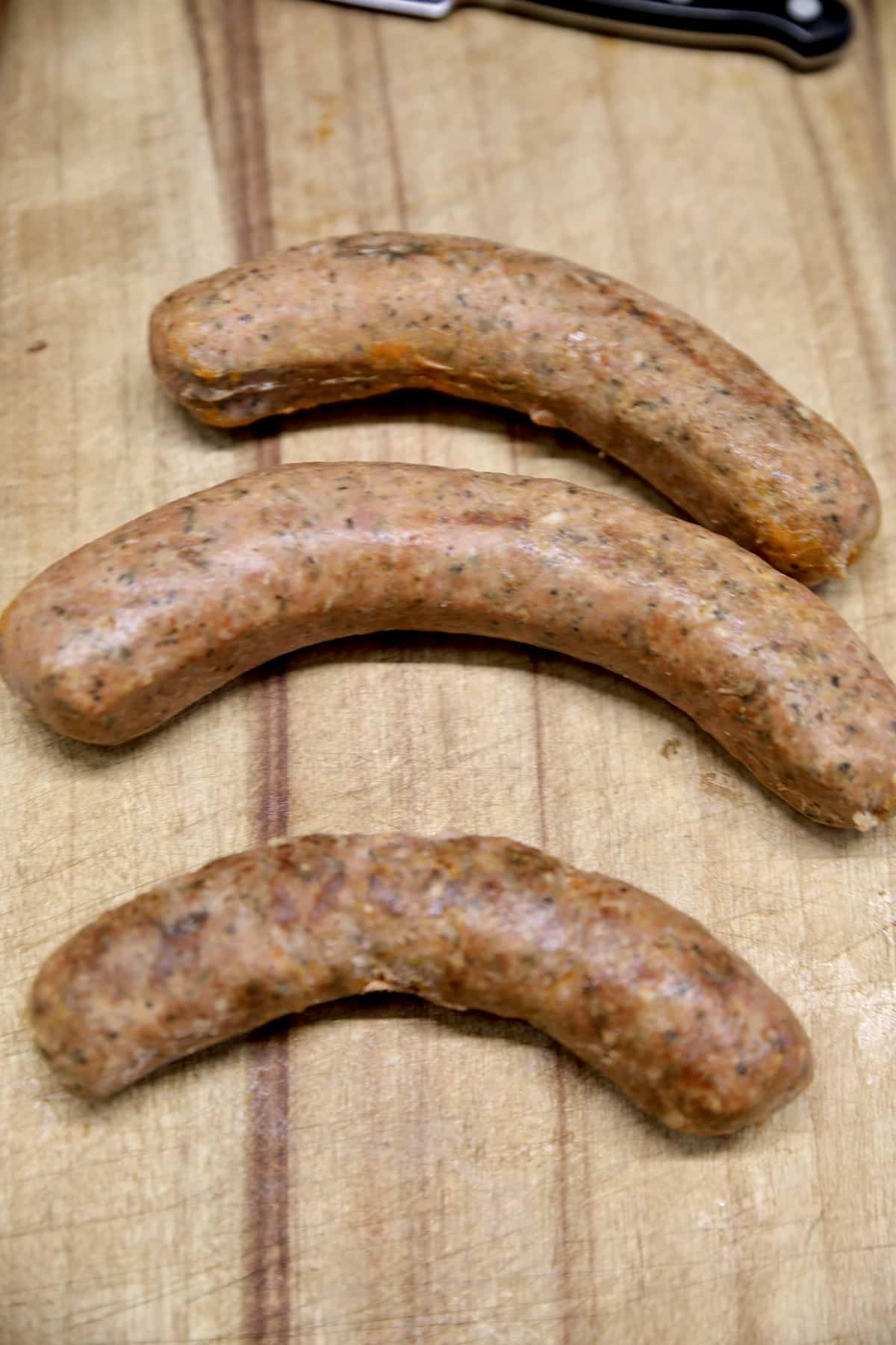 3 links of smoked sausage, uncooked.