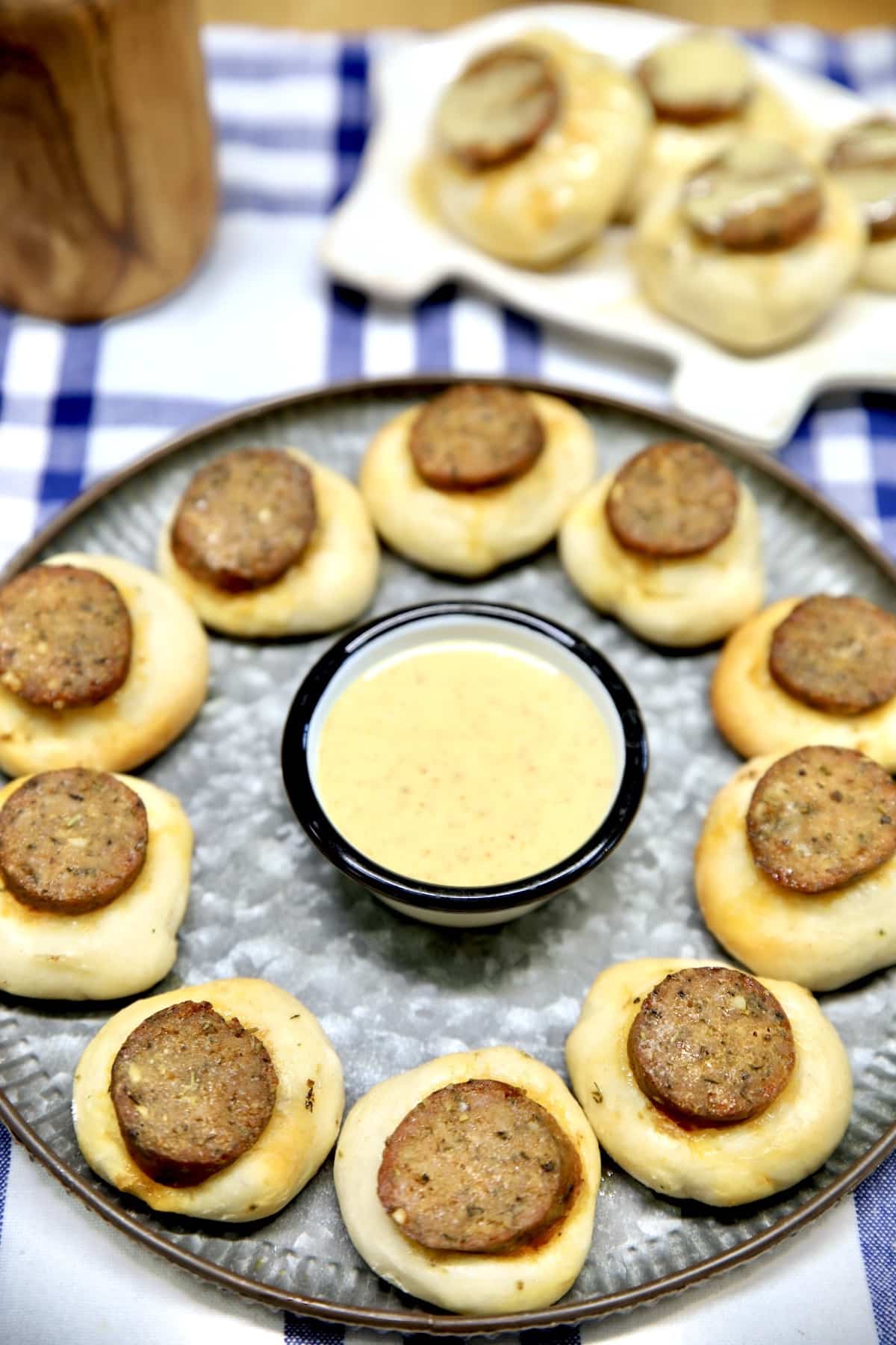 Smoked Sausage Appetizer Bites on a platter with honey mustard.