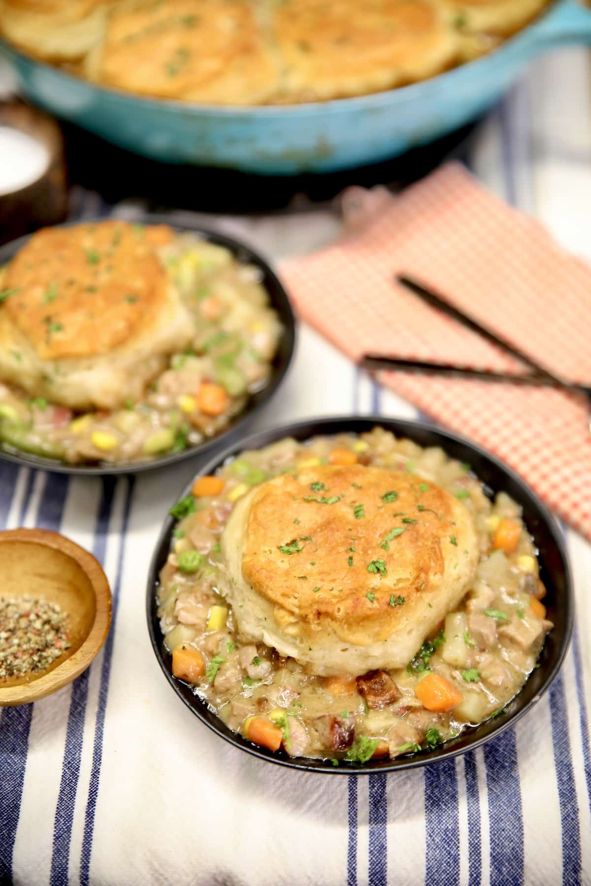 Biscuit topped beef pot pie in bowls.