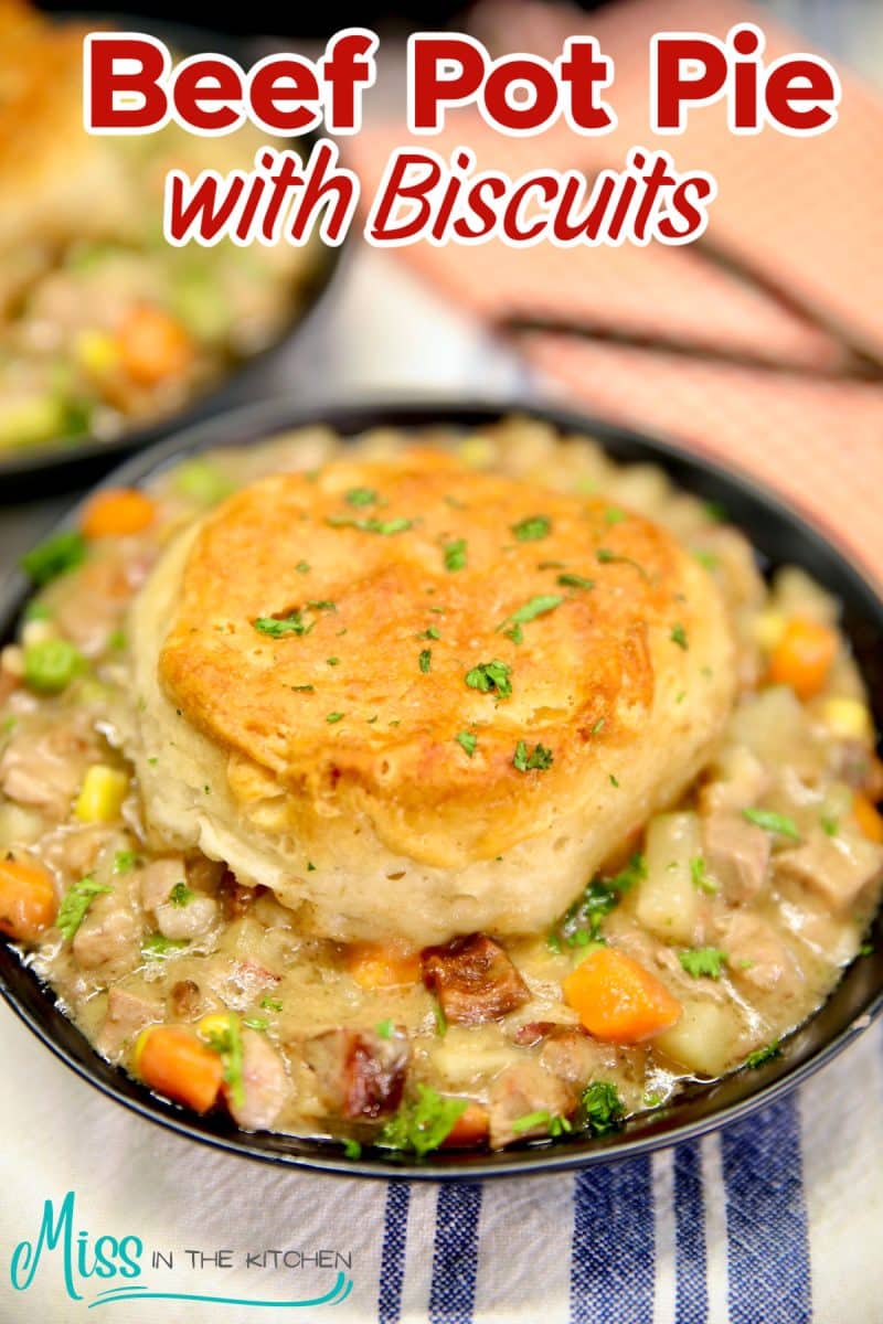 Beef pot pie with biscuits in a bowl - text overlay.