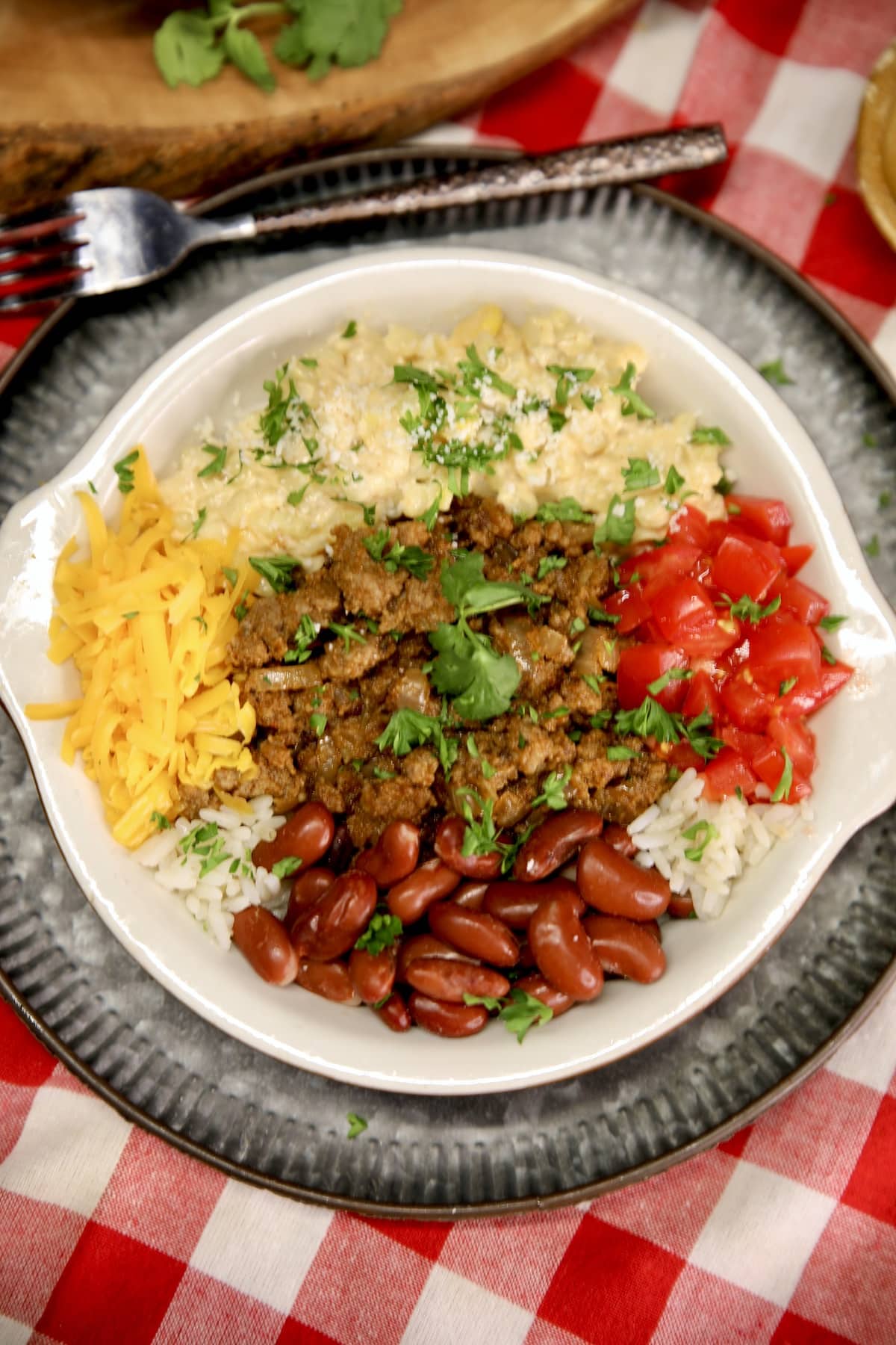 Ground beef burrito bowl with beans, rice and corn. 