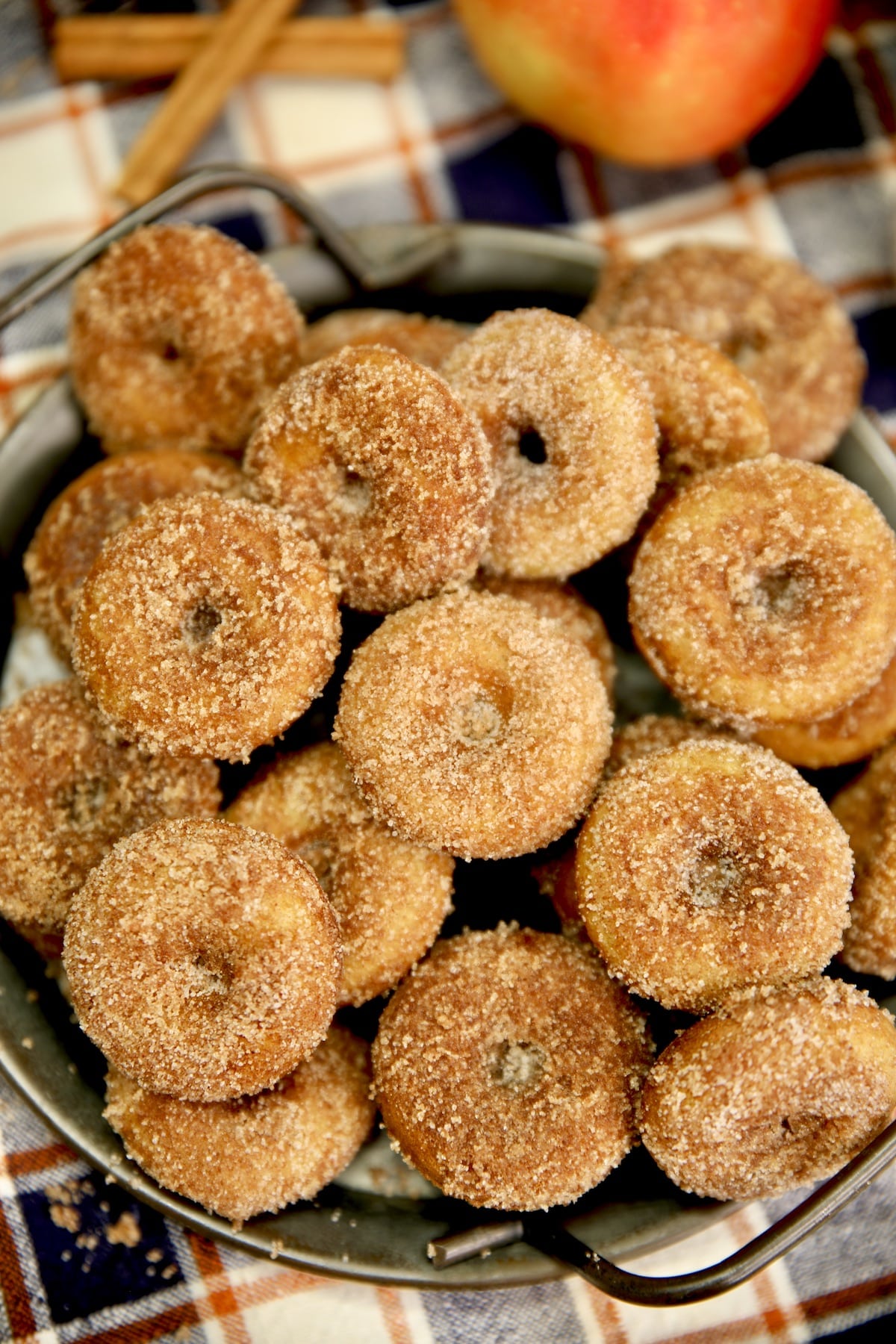 Platter of mini apple cider donuts with cinnamon and sugar coating.