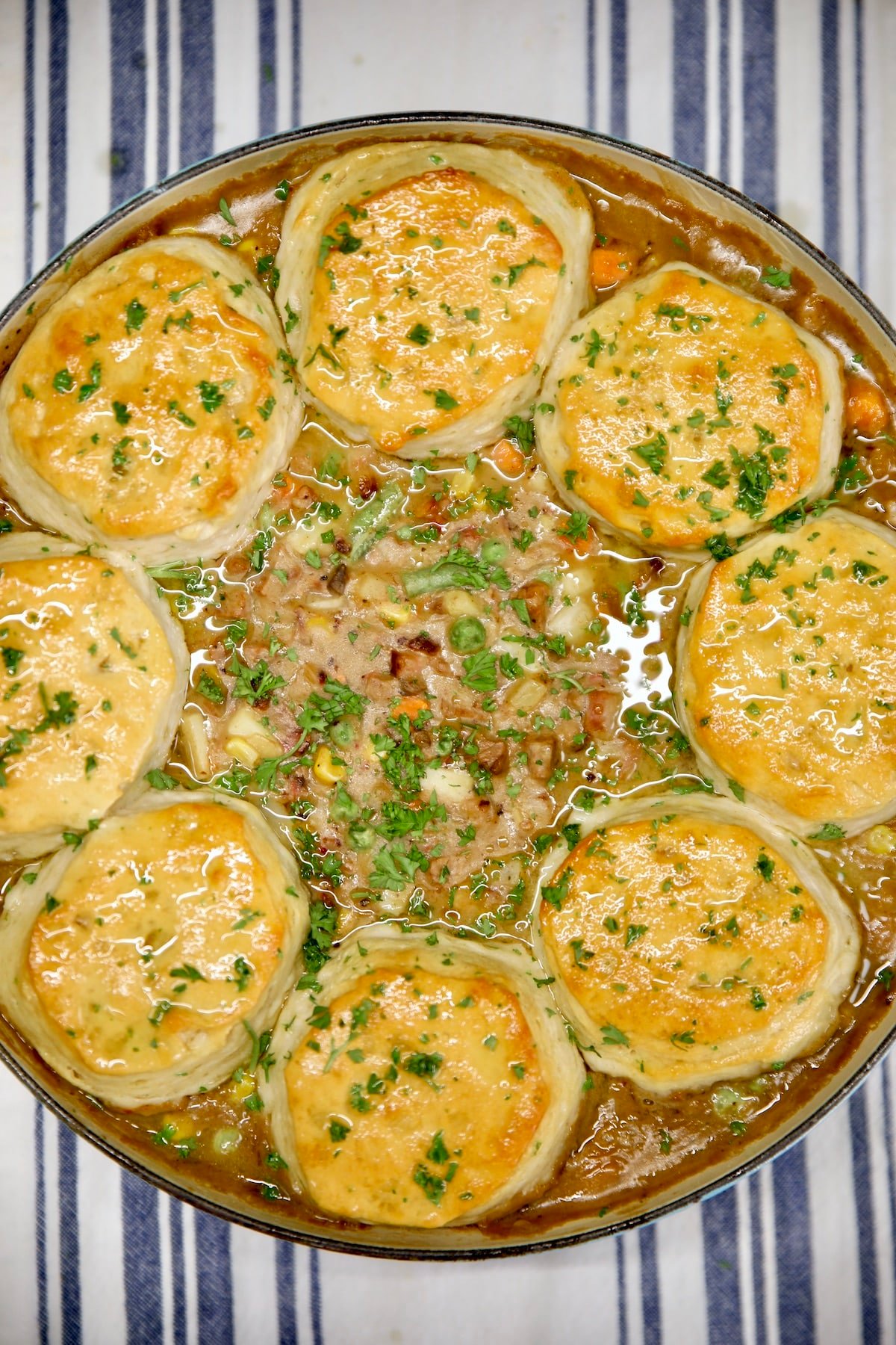 Pan of beef pot pie with garlic biscuits.