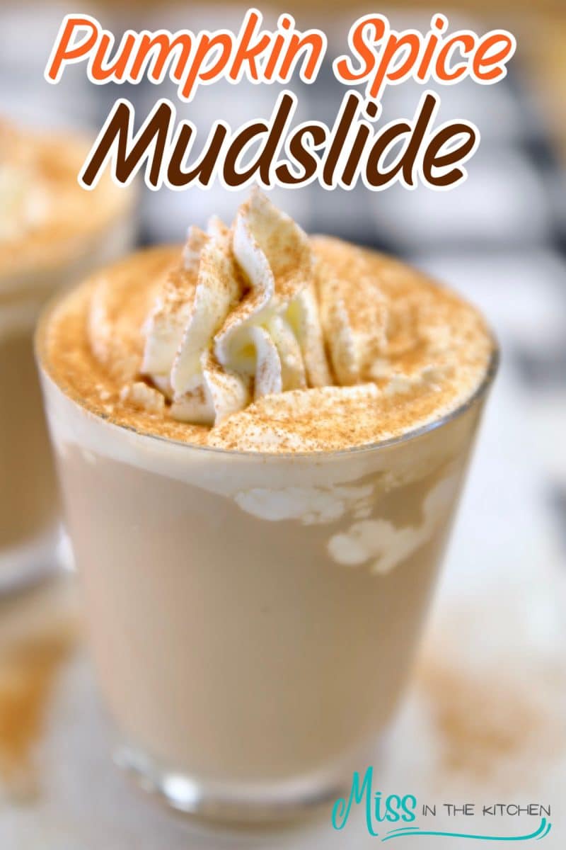 Pumpkin spice mudslide cocktail with whipped cream - text overlay.
